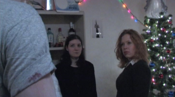 Two college girls meet a zombie at a party in The Heart of Christmas, costume design by Katharine Tarkulich