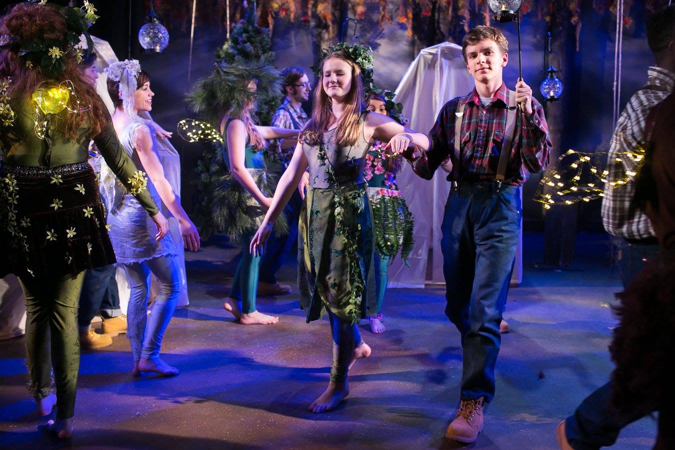 Fairies with light up glowing wings and Sprites as lumberjacks dancing in Shakespeare's A Midsummer Night's Dream costume design by Katharine Tarkulich